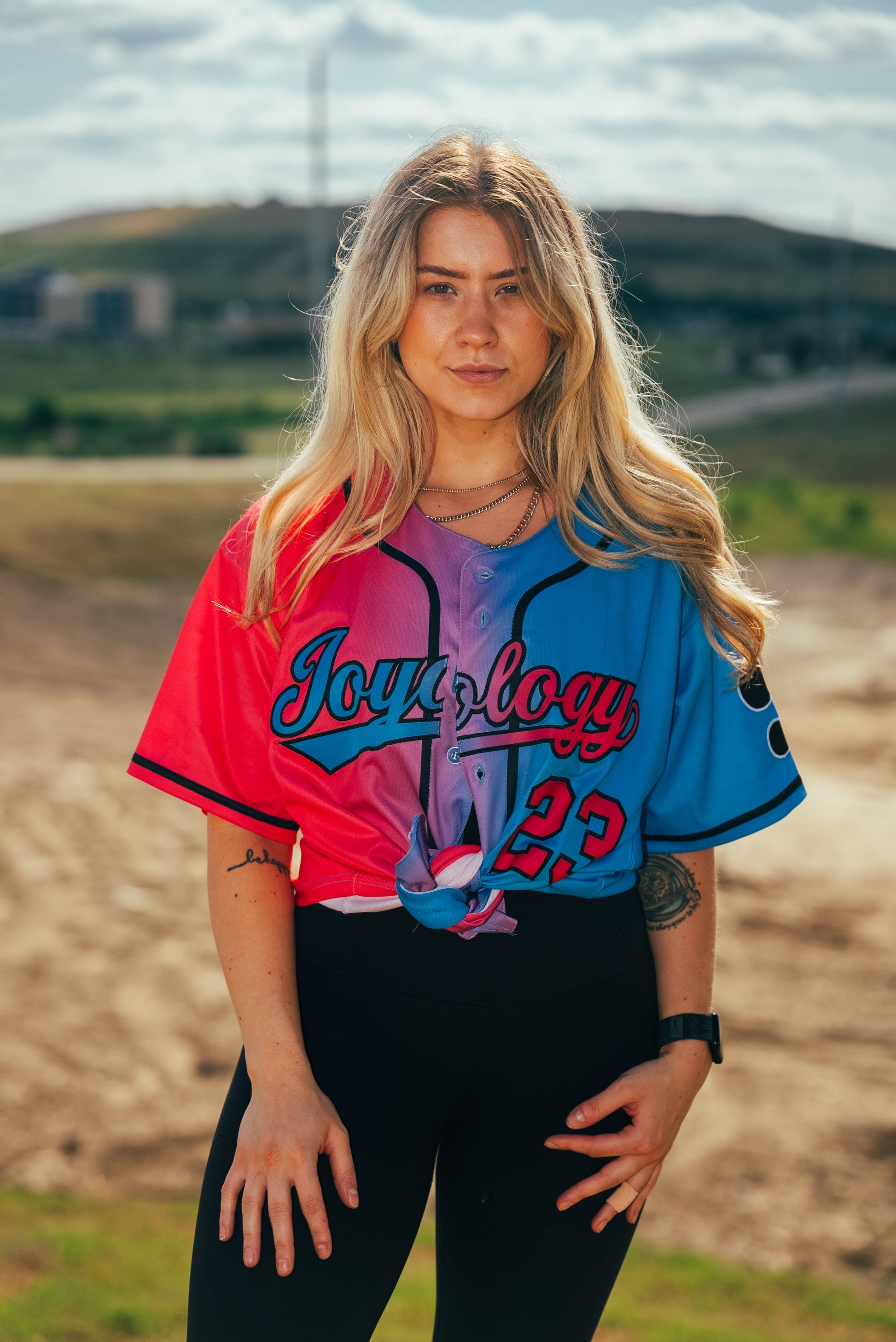 Woman wearing Joyology baseball jersey