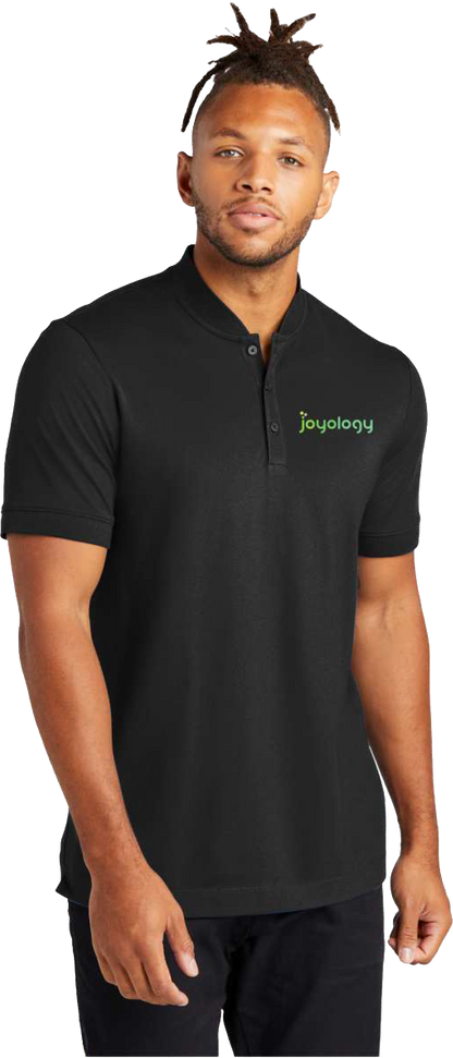 Man wearing black polo with Joyology logo